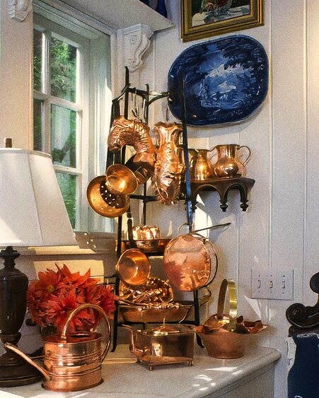Cottage kitchen with European antiques and copper cookware