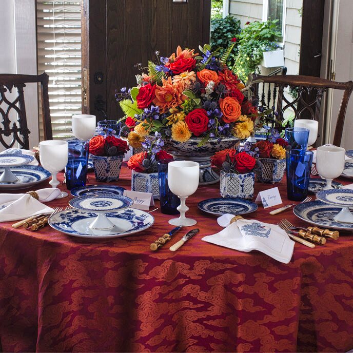 Garden roses in antique vase on weathered table